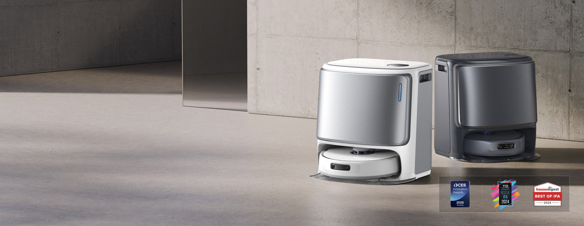 Pictures of two narwal freo z ultra vacuum robots, one in silver-gray and one in black.
